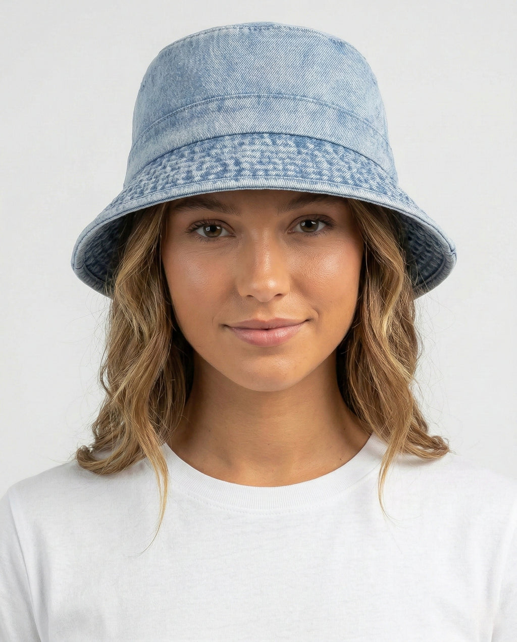Model wearing washed denim bucket hat for big heads