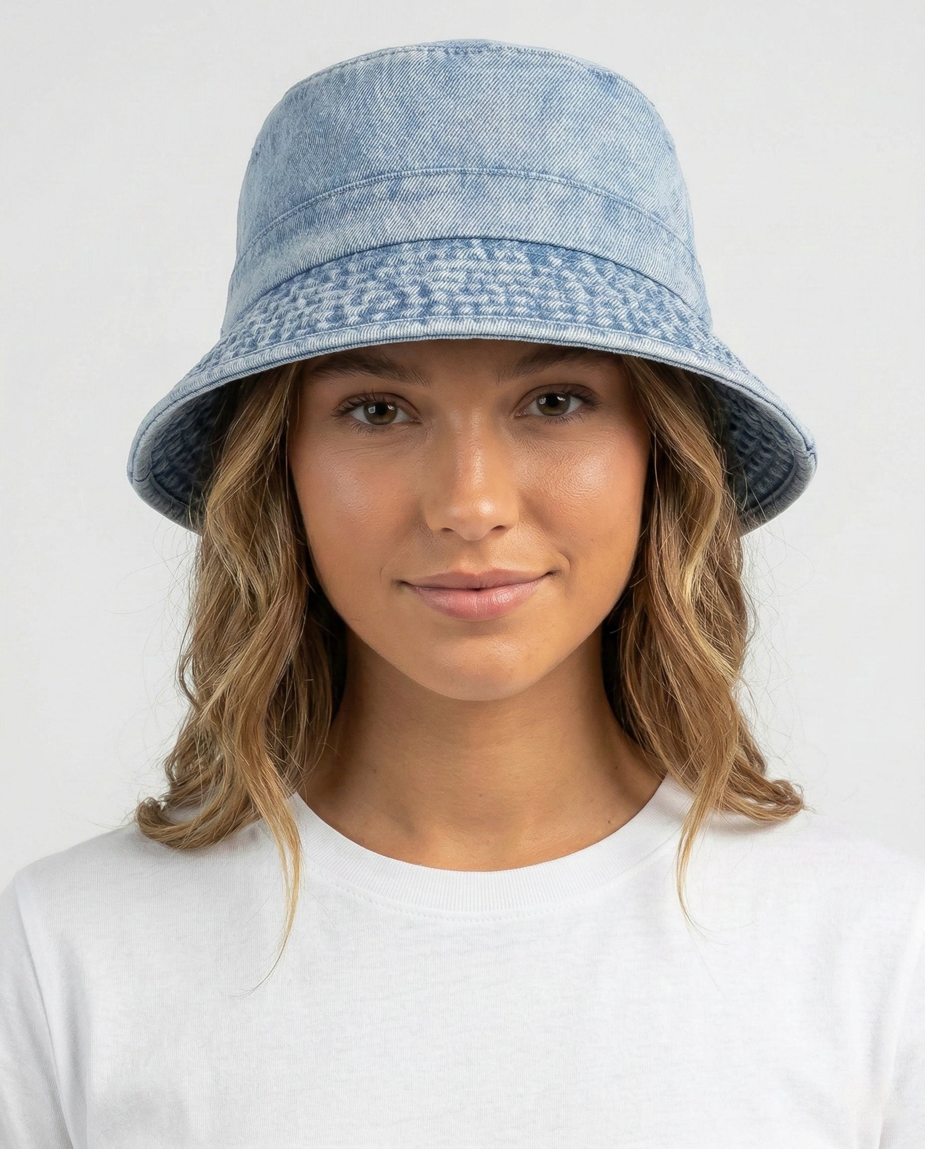 Model wearing washed denim bucket hat for big heads