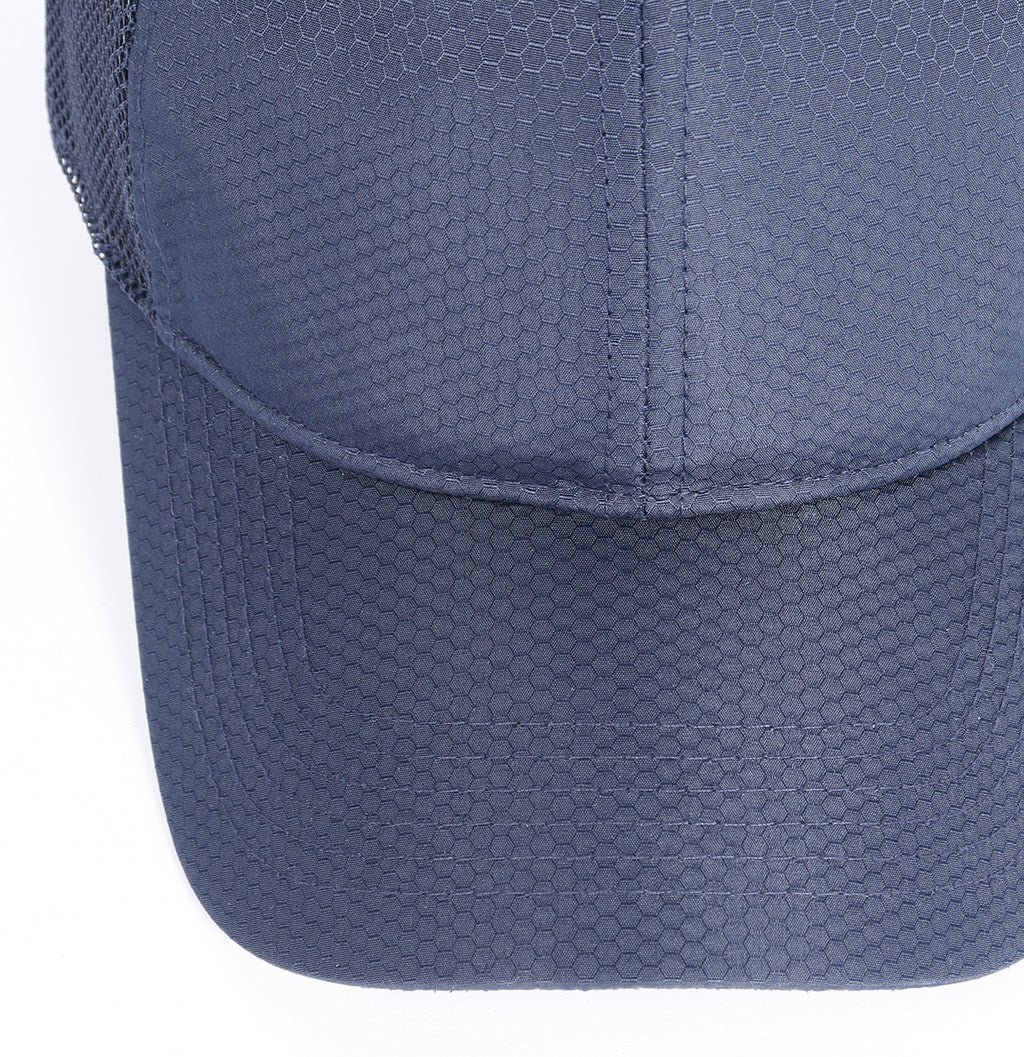 Navy blue breathable mesh trucker hat for big heads - curved brim close-up